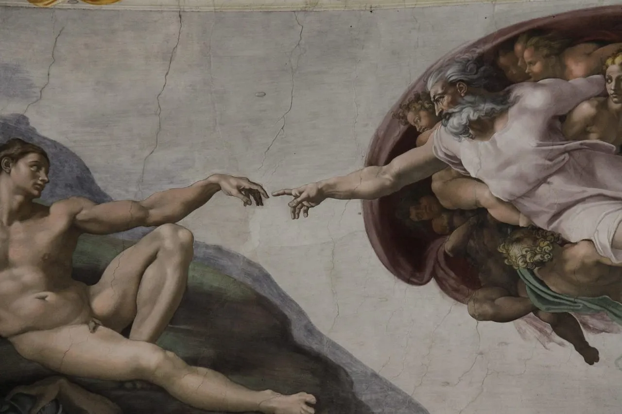 La Creación de Adán de Miguel Ángel en la bóveda de la Capilla Sixtina